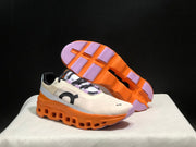 On Cloudmonster Running Shoes in Yellow Tan and Orange