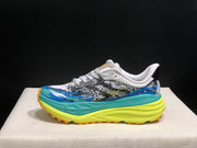 HOKA Stinson 7 Trail Sneakers in Blue and Lime