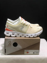 On Cloud X 4 Sneakers in Cream and Orange