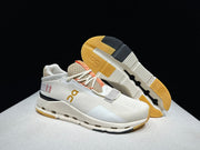 On Cloudnova 2 Sneakers in Ivory and Orange
