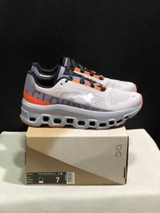 On Cloudmonster Sneakers in Foggy White and Orange