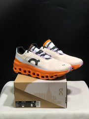 On Cloudmonster Running Shoes in Yellow Tan and Orange